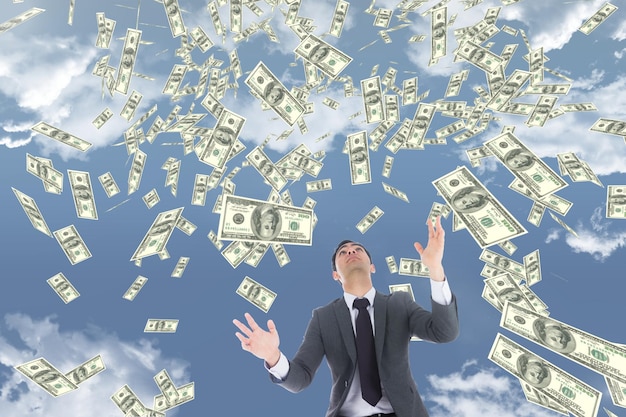a man in a suit and tie is throwing money in the air
